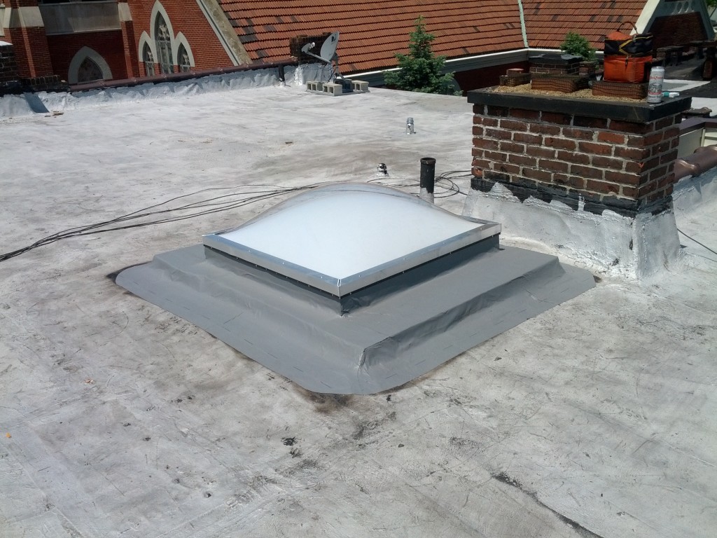 A properly installed skylight on a commercial building by the Reader Roofing team.