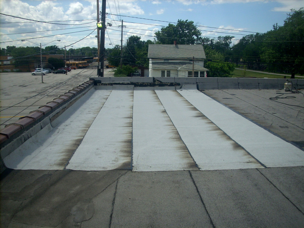 Reader roofing installed the modified bitumen cap sheet and torched in down the lower layers to complete this commercial roof repair.