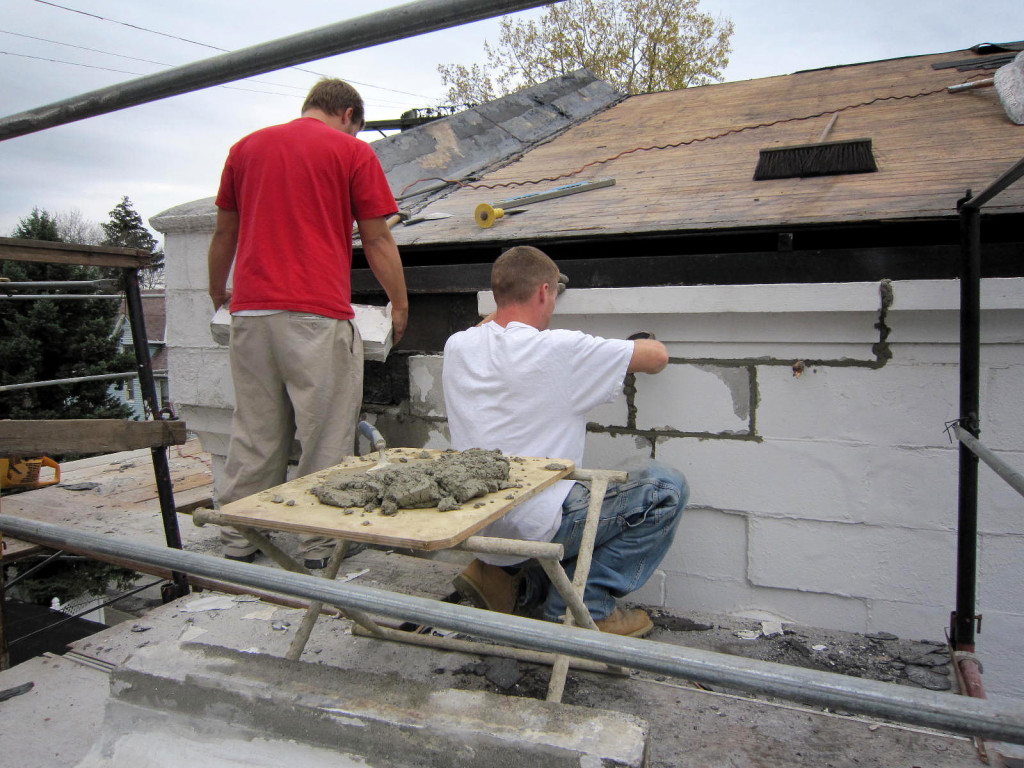 The masonry crew works on the brickwork on this Cleveland church.