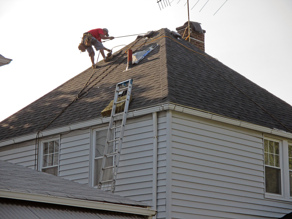 Reader crewmember working on the roof.